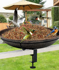 Deck Mounted Bird Bath With Detachable 12 Inch Bowl Thats A Breeze To Clean 0.7 Gallon Capacity Metal Bird Bath For Railings Balcony Fence Outdoors Adjustable Clamp Fits 0.5 To 3.5 Inch with birds feeding and flying around in a garden setting.