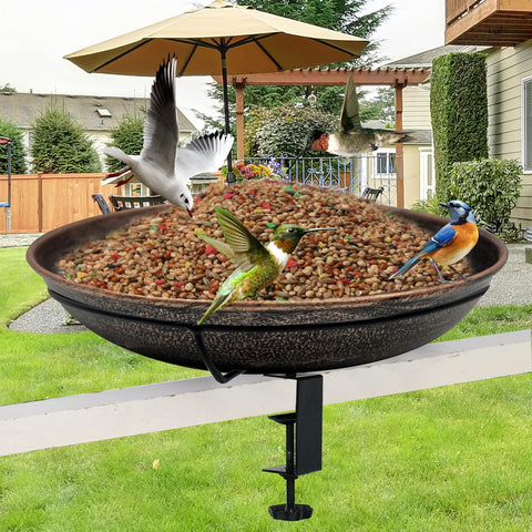 Deck Mounted Bird Bath With Detachable 12 Inch Bowl Thats A Breeze To Clean 0.7 Gallon Capacity Metal Bird Bath For Railings Balcony Fence Outdoors Adjustable Clamp Fits 0.5 To 3.5 Inch with birds feeding and flying around in a garden setting.