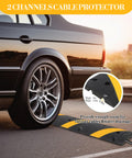 Two Pack Recycled Rubber Speed Bump Set With 25,000 Pound Capacity Durable Cable Protector Ramp in use under car tire