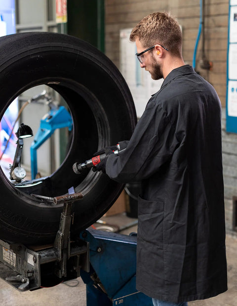 Technician using Air Tire Buffer With 7 Sixteenth Inch Hex Quick Change Chuck Low Speed Light Duty Polisher For Tires 3000 RPM