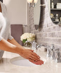 Person washing hands using Dartmoor Chrome Traditional Two Handle Widespread Bathroom Sink Faucet Valve Required Fits 8 To 16 Inch Centers With Classic Old School Chrome Finish T6805