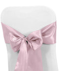Pink satin chair sash bow tied on a white chair for wedding and banquet decor, 10 Piece Satin Chair Sashes Bows For Wedding Reception And Banquet Decor Universal Back Tie For Chairs Party And Hotel Events 7 Inches Wide By 108 Inches Long 100 Percent Polyester Satin.