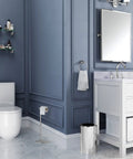 Freestanding Toilet Paper Holder Stand With Weighted Base In Modern Rectangle Chrome Finish For Bathroom Vanity A Must Have Upgrade You Can Move Anytime Grab And Go No Wall Mount Needed Sleek Contemporary Design on a white tiled floor in a blue bathroom