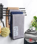Top Shelf Swivel Towel Rack Built From Solid 304 Steel Spacious Four Arm Wall Mount Bath Station Sporting Rustproof Spin Nifty Side Hook And Chill Matte Black Finish with towels.