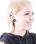 Person wearing Dope Hollow Silicone Ear Tunnels And Plugs Set For Piercing Expander Kit, showcasing black double-flared gauges.