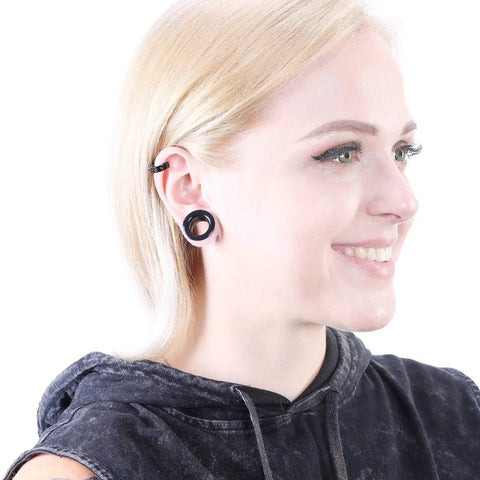 Person wearing Dope Hollow Silicone Ear Tunnels And Plugs Set For Piercing Expander Kit, showcasing black double-flared gauges.