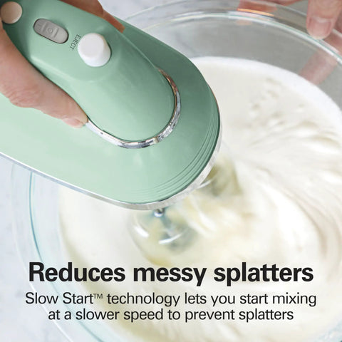 Retro 5 Speed Electric Hand Mixer With SmartBoost Tech And Powerful Dc Motor Designed For Effortless Mixing Whipping Dough And Creating Delicious Homemade Desserts This Slick Kitchen Gadget in green mixing cream in a glass bowl.