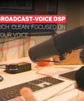USB XLR Audio Interface For Creators With Built In DSP Mic Chain, on desk next to microphone, keyboard, and monitor