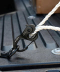 CamJam XT Aluminum Rope Tightener Large With Carabiner Clip For Quick Tie Downs attached to rope in truck bed