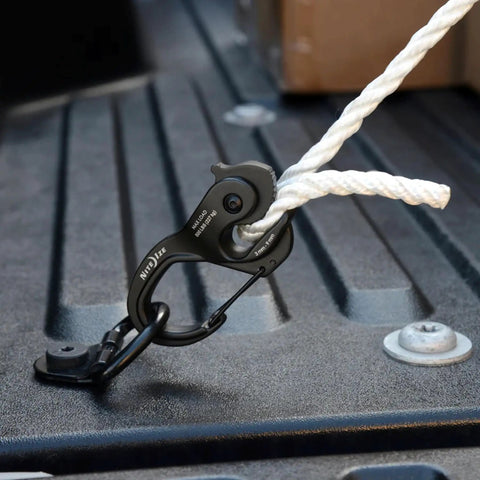 CamJam XT Aluminum Rope Tightener Large With Carabiner Clip For Quick Tie Downs attached to rope in truck bed