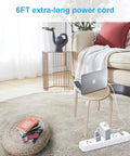 Living room with a Wall Mounted Power Strip With Four Outlets, Surge Protector, Six Foot Extension Cord beside a chair and laptop.