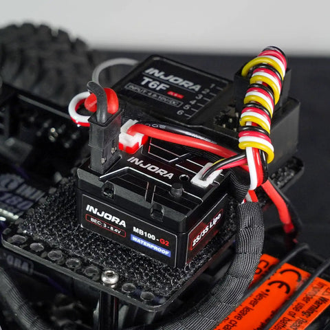 Close-up of the 40A Brushed ESC for 1/24 and 1/18 RC Crawlers with IP67 waterproof, compact G2 design, and app tunable speed controller.