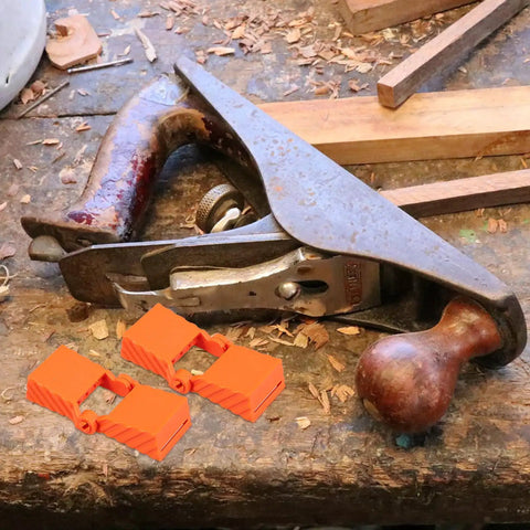 4 Piece Ratchet Woodworking Strap Clamp Blocks Set For Quick Fix Band Clamps shown next to a woodworking planer on a workbench