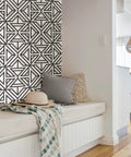 Room corner with Black And White Geometric Peel And Stick Wallpaper For DIY Projects Repositionable And Removable With No Residue Sticks To Smooth Surfaces Safe For Walls Modern Linear Pattern For Quick Accent Transforms on wall behind a cozy bench.