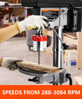 13 Inch Heavy Duty Floor Drill Press With 7 Point 5 Amp Motor And Rock Solid Cast Iron Base, Street Tested Variable Speed Range 288 To 3084 Rpm, Precision Tilt Table For Wood And Metal Jobs in action drilling wood.