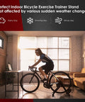 A person using a Magnetic Bike Trainer Stand For Indoor Cycling And Home Gym Use in a living room setting.