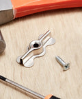 Double Wing Flush Mounting Clips With Screws Alloy Steel Recessed Trim Hardware Silver Drywall Fasteners For Wall Panels 24 Pack on wooden surface with tools.
