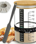 Pro Sourdough Bread Starter Kit with 34oz jar, silicone cover, spatula, and bread, showcasing home baking supplies.