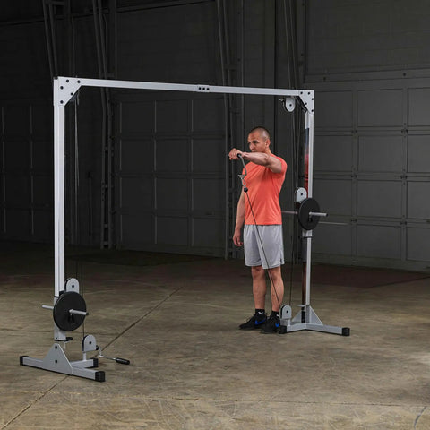 Man using Beefy Heavy Duty Cable Crossover Machine For Home Gym Functional Trainer with dual pulleys in a gym setting.