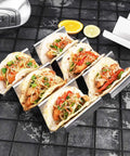 Stainless Steel Taco Holders 4 Pack, Durable Taco Stand Rack Tray Style, Oven Safe for Baking, with street tacos and toppings.