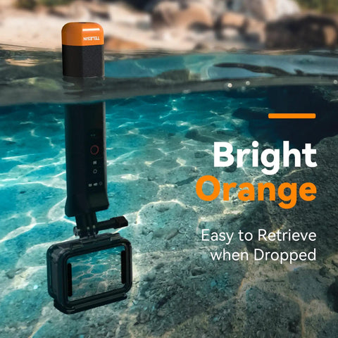 Bright orange floating selfie stick with Bluetooth remote, submerged in water, ideal for GoPro Hero underwater shots.
