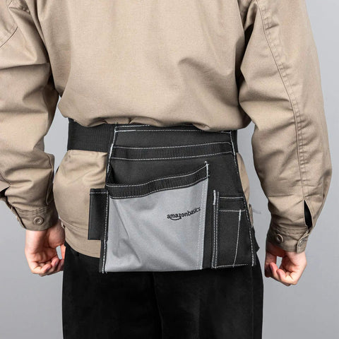 Back view of Heavy Duty Carpenter Apron With Five Pockets Adjustable 32 To 56 Inch Waist Durable Canvas Tool Belt on person