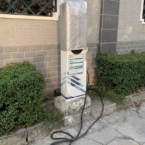 Heavy Duty Ev Charger Rain Cover For Electric Vehicle Stations Ultra Weatherproof Outlet Guard Box protecting a charging station outdoors.