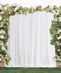 Outdoor Mosquito Net For Porch, Patio, Gazebo 2 Panels Waterproof Sheer Tulle Curtains, Mesh Privacy Drapes With DIY Adjustable Length, White, 118 By 98 Inches installed on floral arch.