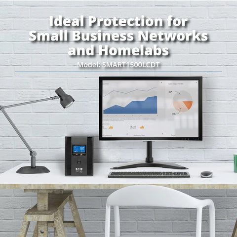 Smart1500LCDT 1500VA UPS Battery Backup With 900W Output beside computer on desk in home office setup.
