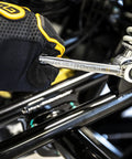 Man using 19Mm 4 Degree Swing Arch 12 Point Ratcheting Combination Wrench With Off Corner Loading And Dual Direction Ratcheting For A Tight Grip In Small Spaces 90 Tooth Box End on a suspension component.