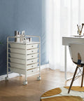 Six Tier Utility Cart With Six Drawers Rolling Cart With Two Lockable Caster Wheels Multipurpose Mobile Drawer Cart For Office Kitchen And Bathroom Ivory White placed in a stylish room
