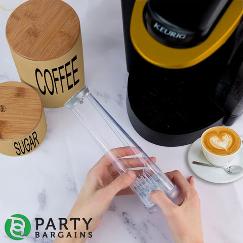Hands holding filter holder next to Keurig 2.0 with coffee mug, part of Water Filter Starter Kit For Keurig 2.0 Coffee Brewers.