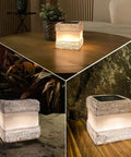2 Pack Solar Rock Lights Outdoor Waterproof Fake Rock Pathway Lights with Warm LED Glow in indoor and outdoor settings.