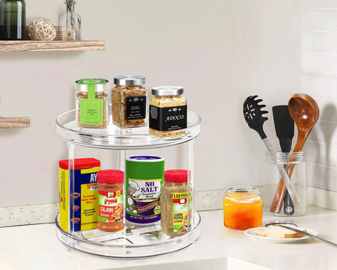 Two Tier Lazy Susan Turntable Organizer For Bathroom And Vanity, Clear 9.25 Inch Rotating Makeup Organizer with spices on counter