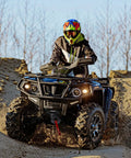ATV on rugged terrain with 12V Electric Winch With Synthetic Rope 4500Lbs Wireless Towing Kit For ATV UTV Off Road