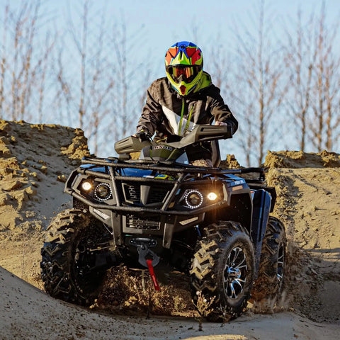 ATV on rugged terrain with 12V Electric Winch With Synthetic Rope 4500Lbs Wireless Towing Kit For ATV UTV Off Road