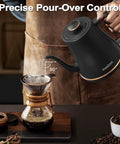 Gooseneck Electric Kettle 0.8L For Pour Over Coffee And Tea With Precision Spout Stainless Steel Inner Lid And Bottom Auto Shut Off Boil Dry Protection Black For Coffee Nerds And Tea Lovers Who Want That Barista Style Pour Every Time being used to pour water into a coffee dripper on a wooden table.