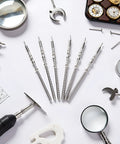 5 Piece Silver Movement Watch Stem Crown Kit For NH Series Movements NH35 NH36 NH38 NH39 with repair tools on a table