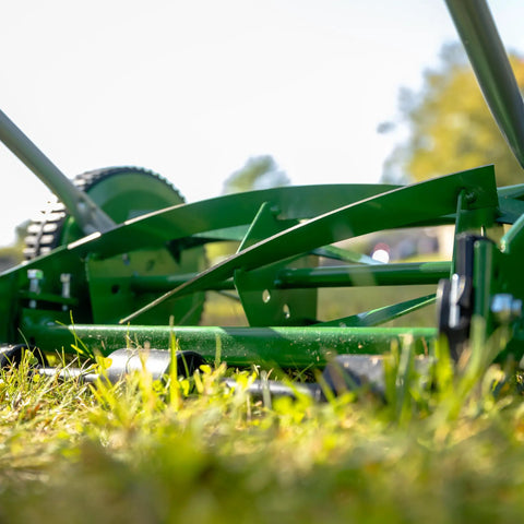Close-up of No Sweat 14 Inch 5 Blade Push Reel Lawn Mower With Ball Bearing Reel And Cushioned T Style Handle on a lawn