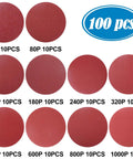 Pro Grade 6 Inch Sanding Discs Set, 100 Pieces With Ten Each Of 60 80 120 180 240 320 400 600 800 1000 Grit, shown in various grits