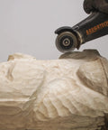 No Nonsense Heavy Hitter 8 Amp Mini Wood Carving Router carving a detailed design on a wooden sculpture.