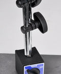 Front view of Fowler magnetic base with chrome vertical posts, black adjustable clamps, on a black base with blue label.