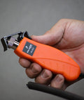 Person holding orange Round Cable Stripper Tool for Precise Jacket Removal, Adjustable Slitter Fits 4.5 to 25 mm Cables