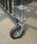 Smooth As Butter 8 Inch Pneumatic Rubber Gate Wheel With Spring Suspension mounted on gate, showcasing heavy duty design and tire.