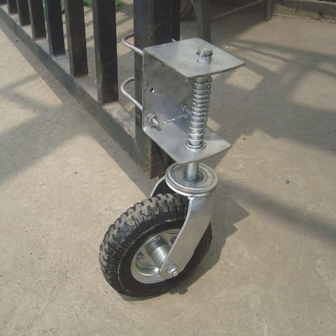 Smooth As Butter 8 Inch Pneumatic Rubber Gate Wheel With Spring Suspension mounted on gate, showcasing heavy duty design and tire.