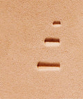 Close-up of leather with impressions from Double Beveler Stamp Set For Leathercraft, 3 Piece Pro Grade Stainless Steel Bevelers.