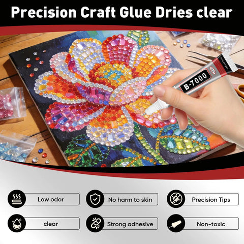 Hand holding tube of Clear Glue With Precision Tip 15ml 50 Pack for gluing rhinestones on colorful flower canvas art.