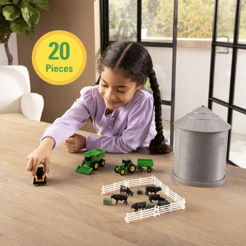 Child playing with 1 64 Scale Farm Playset With Grain Bin Includes Tractor Toys Skid Steer Farm Animal Figures And Fencing