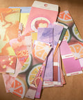 Starter Scrapbook Kit With Aesthetic Ephemera And Junk Journal Supplies in dessert-themed colors and patterns assorted papers