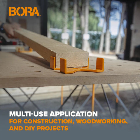 Universal 2x4 Support Bracket Four Pack Top Shelf Jig on a wooden workbench securing a plank for woodworking tasks.